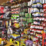 Wall of fishing tackle and bait inside a restaurant shop