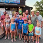 Family posing outside Table Rock Lake Restaurant near Branson