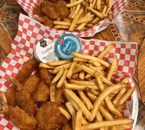 Fried shrimp baskets with French fries and dipping sauces